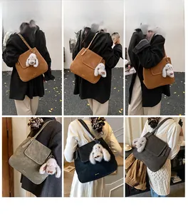 Detailed model views of retro suede bucket bag in brown, grey and black with cute rabbit charm