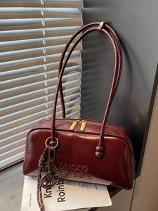 Retro burgundy oil wax leather Boston bag with dual handles and embossed lettering