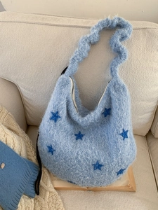 Light blue plush hobo bag with dark blue star embroidery and ruffled shoulder strap