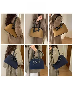 Detail shots of khaki and navy wool texture underarm bags with leather straps