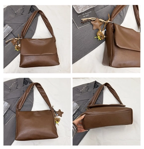 Detail view of brown faux leather tote bag with star and bear charms in a grid layout