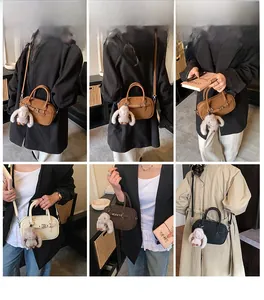 Detailed view of women retro crossbody bag styles with decorative plush rabbit charms
