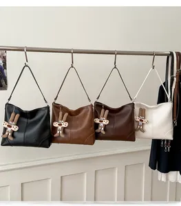 Close-up of vintage large capacity tote bags in four colors with cute bunny pendants