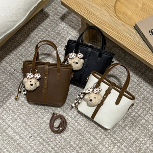 Minimalist leather bucket bag set in brown, black, and beige with cute bear charms