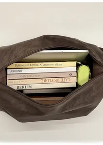 Spacious dark brown faux leather shoulder bag holding a laptop and books for daily use