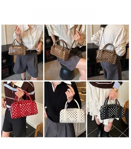 Detailed view of four colorful polka dot crossbody bags with metallic circular handles