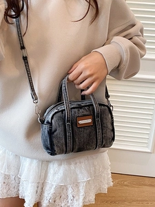 Vintage dark gray washed denim handbag with leather logo patch and shoulder strap