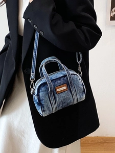Distressed blue denim mini Boston bag with brown leather patch and detachable strap