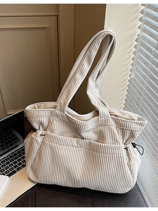 Beige corduroy tote bag with drawstring details and large capacity for daily use