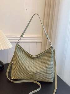 Borsa a tracolla plissettata verde salvia con trama a nido d'ape e cinturini regolabili