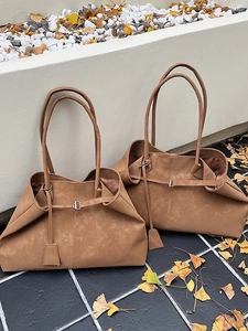 Vintage brown suede large capacity tote bag with buckle detail on minimalist background