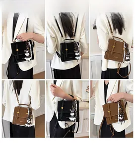 Detailed views of vintage retro backpack with schnauzer charm and silk scarf decoration