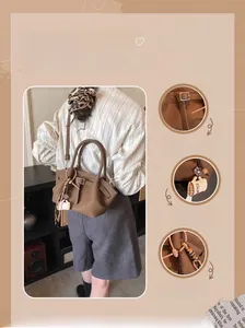 Brown pleated bucket bag detail with coffee cup charm and stylish metal buckle strap