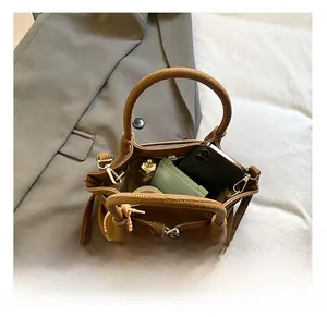 Internal view of the brown leather crossbody bag showing space for phone and essentials
