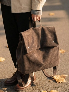 Minimalist brown suede backpack for women with flap cover and silver metal rivets