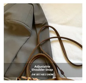 Close-up of brown litchi pattern leather bucket bag with adjustable shoulder strap