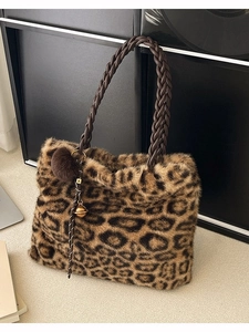 Large leopard print faux fur tote bag with braided leather handles and plush keychain
