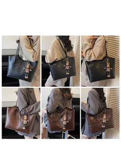 Detailed views of vintage large tote bags in black and brown with cute rabbit charms