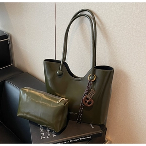 Olive green leather tote bag set featuring a matching pouch and woven rope charm