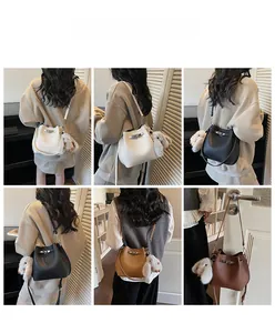 Detailed views of leather bucket bags in four colors with cute rabbit charms and silver clasps