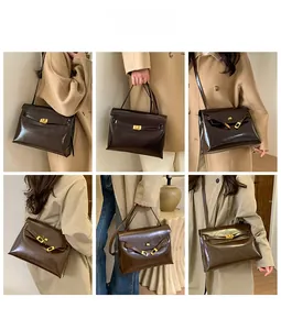 Detail view of vintage leather Kelly bag showing crossbody and shoulder wear styles