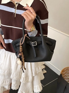 Classic black litchi pattern bucket bag with decorative coffee pendant and silver buckle