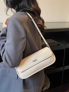 Chic cream white leather baguette bag with silver metal logo for women style