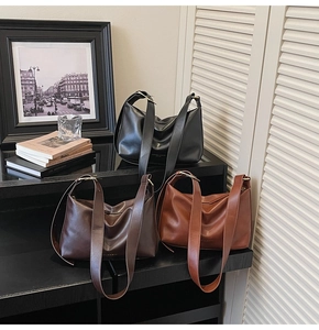 Detailed arrangement of soft leather tote bags in black, coffee, and caramel colors