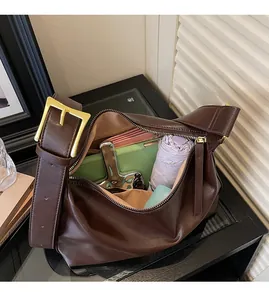 Interior detail of large brown hobo bag showing spacious capacity for daily items