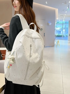 White casual backpack with silver star print and plush moon charm for students