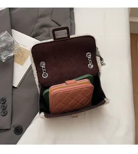 Detailed internal view of chain bag showing spacious capacity for wallet and smartphone