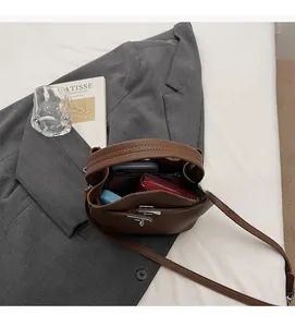 Interior view of brown lychee grain leather bucket bag showing large storage capacity