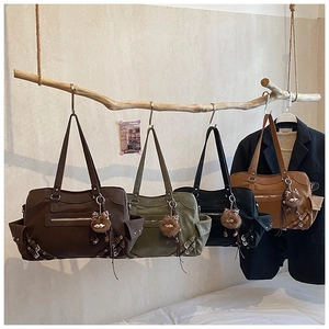 Retro tote bags in four colors hanging on wooden branches for stylish commute storage