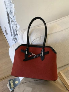 Retro red woven shoulder bag with black leather trim and silver metal hardware accents