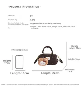 Detailed view of Boston bag dimensions with a brown vintage PU finish and bear charm