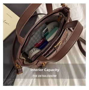 Internal capacity of the brown pleated bucket bag showing cosmetics and storage space