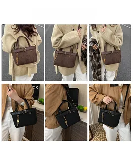 Detail shots of retro pleated leather bucket bag with metal key charm and strap