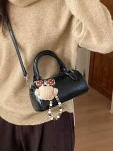 Chic black cylinder handbag made of PU leather with a cute bear charm for daily wear