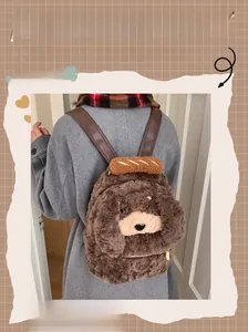 Detail of plush cartoon puppy backpack featuring leather straps and decorative baguette toy