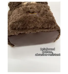 Detail view of the brown plush backpack with reinforced PU base for anti-wear protection