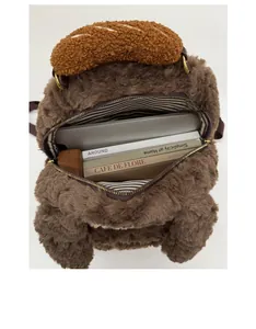 Spacious interior of plush cartoon dog backpack with striped lining and daily essentials
