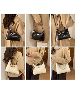 Detail view of quilted bucket bag with chain strap and bead charm in various outfits