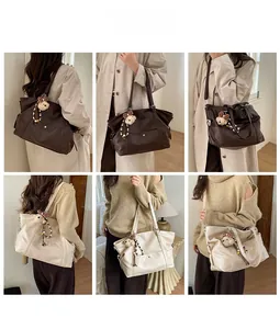 Detailed views of vintage tote bags in brown and beige with plush bear charms