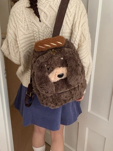 Cute brown plush poodle backpack with caramel bread accessory and adjustable leather straps