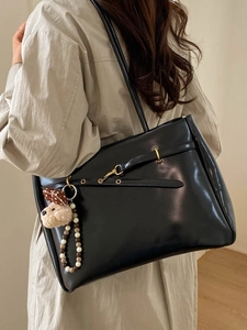 Minimalist black faux leather tote bag with gold buckle and cute puppy charm