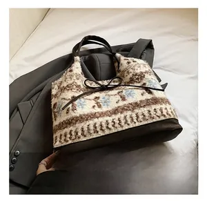 Detail of plush floral tote bag with lamb wool texture and faux fur finish