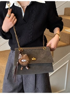 Vintage dark gray crossbody bag with gold chain strap and cute plush charm pendant