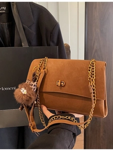 Vintage brown suede tote bag with golden chain straps and leopard print bow charm