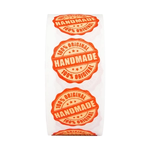 Roll of orange handmade labels with scalloped edges for festive baking and gift packaging