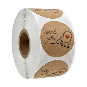 Baked with Love kraft paper labels in a roll, featuring oven mitt and red heart design